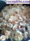снимка 2 към рецепта Запечени картофи с кренвирши