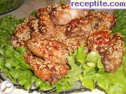 снимка 2 към рецепта Пилешки крилца със соев сос, чесън и сусам